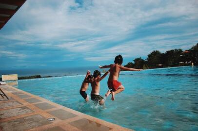 Kids jumping in pool